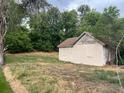 Image of an outbuilding surrounded by greenery on the property at 5302 Tennyson St, Denver, CO 80212
