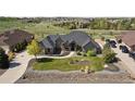 Stunning single-story home featuring a meticulously landscaped front yard and inviting walkway at 12939 Wabash Ct, Thornton, CO 80602