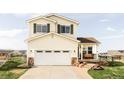 Charming two-story home featuring a spacious two-car garage and a welcoming front porch at 9665 Bighorn Way, Littleton, CO 80125