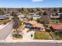 Aerial view showcasing the home's location, well-manicured lawn, and surrounding neighborhood at 6500 S Downing St, Centennial, CO 80121