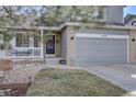 Charming two-story home with a well-manicured lawn and an attached two-car garage at 2888 Deer Creek Trl, Highlands Ranch, CO 80129