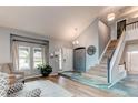 Inviting foyer boasts high ceilings, tile entryway, and a view of the staircase, complemented by stylish furnishings at 6647 Lynx Cv, Lone Tree, CO 80124