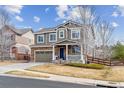 Charming two-story home with stone accents, inviting front porch, and well-manicured landscaping at 23469 E Briarwood Pl, Aurora, CO 80016