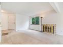 Bright and airy living room with fireplace and neutral carpet at 72 S Nome St, Aurora, CO 80012