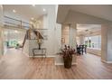 Inviting foyer with hardwood floors, staircase, and elegant decor creating a grand entrance at 7829 S Coolidge Way, Aurora, CO 80016