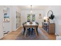 Elegant dining room with a large table, seating for eight, and built-in cabinets creates a perfect space at 7629 S Fillmore Way, Centennial, CO 80122