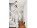 Elegant foyer with a staircase and hardwood floors, creating a grand entrance at 1939 W 39Th Ave, Denver, CO 80211