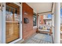 Cozy front porch with seating, providing a relaxing outdoor space at 1939 W 39Th Ave, Denver, CO 80211