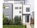 Contemporary two-story home features a simple, clean design and minimalist landscaping at 2685 S Acoma St, Denver, CO 80223