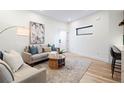 Stylish living room features hardwood floors, neutral furniture, and modern accents at 1727 Lowell Blvd, Denver, CO 80204