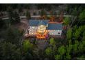 Exterior aerial view of home featuring a deck, hot tub, and scenic woodland setting at 1194 Snyder Mountain Rd, Evergreen, CO 80439