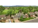 Lovely two-story home surrounded by lush landscaping and a sprawling green neighborhood at 8896 W Prentice Ave, Littleton, CO 80123