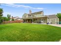 Spacious backyard with lush lawn, perfect for outdoor activities and entertaining at 8896 W Prentice Ave, Littleton, CO 80123
