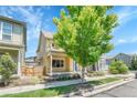 Charming two-story home featuring a welcoming front porch with beautiful curb appeal at 1903 W 66Th Ave, Denver, CO 80221