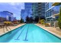 Rooftop pool offers stunning views of the surrounding buildings and blue sky at 1700 Bassett St # 1106, Denver, CO 80202