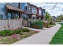 Attractive row of townhouses with well-maintained landscaping and inviting walkways on a sunny day at 4150 Longview Ln, Boulder, CO 80301