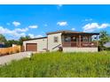 Cute Ranch home with a covered porch and large yard at 6653 N Knox Ct, Denver, CO 80221