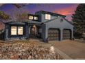 Charming two-story home with a two-car garage and a rock landscaped front yard at 14707 E Wagon Trail Dr, Aurora, CO 80015