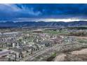 Aerial view of community showcasing mountain views in the distance at 1734 Peak Prairie Ln, Monument, CO 80132