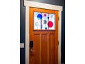 Stylish front door with unique stained glass detailing and modern hardware at 84 Inca St, Denver, CO 80223