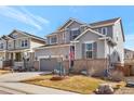 Well-maintained two-story home with a spacious driveway and a nicely landscaped front yard at 2538 Ambience Ln, Castle Rock, CO 80109