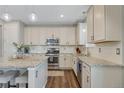 Bright kitchen featuring granite countertops, stainless steel appliances, and ample cabinet space at 2538 Ambience Ln, Castle Rock, CO 80109