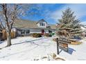 Desirable home with snowy lawn, attractive landscaping, and professionally installed for sale sign at 639 Quartz Way, Broomfield, CO 80020