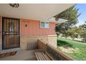 Charming front porch with a decorative security door, a bench, and a welcoming 'welcome' sign at 12101 Riverdale Rd, Brighton, CO 80602