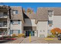 Charming condo building with a well-maintained exterior, blue shutters, and a welcoming entrance at 5995 E Iliff Ave # 317, Denver, CO 80222