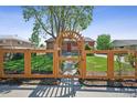 Lovely home featuring a charming fenced yard with an inviting arched entryway at 7820 Tejon St, Denver, CO 80221
