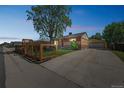 Charming brick home featuring a spacious driveway and well-maintained landscaping at 7820 Tejon St, Denver, CO 80221