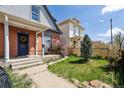 Quaint home with a welcoming porch and well-maintained lawn, creating curb appeal at 308 Inca St, Denver, CO 80223