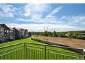 Balcony view of the community and a grassy field at 18726 E Yale Cir # F, Aurora, CO 80013