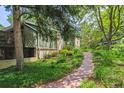 View of rear of house and landscaped yard at 9113 E Evans Way, Denver, CO 80231