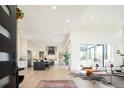 Bright, open-concept living space flows into a modern kitchen with a large center island at 8230 W Tennessee Ct, Lakewood, CO 80226
