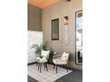 Inviting front porch featuring seating, modern address numbers, stylish decor, and a welcoming atmosphere at 8230 W Tennessee Ct, Lakewood, CO 80226