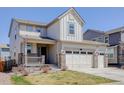 Beautiful home featuring a welcoming front porch and a three-car garage at 434 N Old Hammer St, Aurora, CO 80018