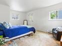 Bright bedroom with a comfy armchair, a double bed, and an exterior entrance at 101 S Downing St # 8, Denver, CO 80209