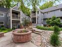 Scenic townhome community with lush landscaping and inviting entrances at 101 S Downing St # 8, Denver, CO 80209
