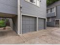 Side view of attached garages with neutral color and access from the back at 101 S Downing St # 8, Denver, CO 80209