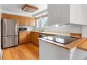 Cozy kitchen with stainless steel appliances and hardwood floors at 101 S Downing St # 8, Denver, CO 80209