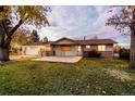 Well-maintained home with an attached garage and a spacious front lawn enhanced by a lovely tree at 8895 Morton Rd, Niwot, CO 80503