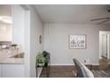 Bright living room with hardwood floors, neutral walls, and mid-century modern furniture at 1716 Moline St, Aurora, CO 80010