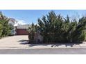 Lovely ranch-style home with a brick facade, attached garage and mature landscaping at 110 Forest St, Denver, CO 80220