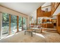 Bright, open-concept living area with large sliding doors and a kitchen view, perfect for entertaining at 5063 E Otero Cir, Centennial, CO 80122