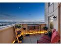 Relaxing balcony boasting city views and comfortable seating at 300 W 11Th Ave # 18C, Denver, CO 80204