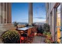 Spacious balcony with city views, seating, and potted plants at 300 W 11Th Ave # 18C, Denver, CO 80204
