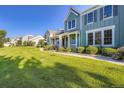 Attractive homes line a well-manicured lawn under a clear blue sky, enhancing community appeal at 19725 Rosewood Ct, Parker, CO 80138