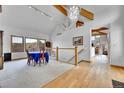 Open-concept dining area with vaulted ceilings, large windows, and elegant finishes at 3794 N State Highway 67, Sedalia, CO 80135