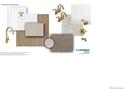 Designer package showcases elegant gold fixtures, modern white tiling, and neutral colored countertops at 1458 Coral Pl, Longmont, CO 80504